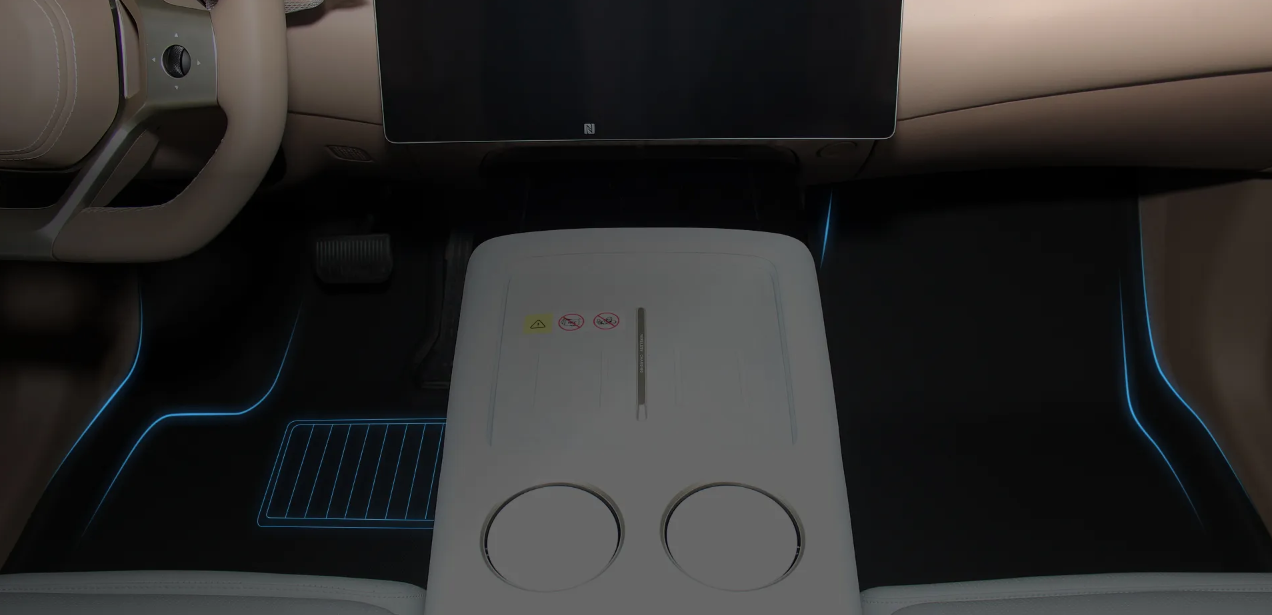 The car's floor mats have the steering wheel on the left side, and the vehicle drives on the right side of the road