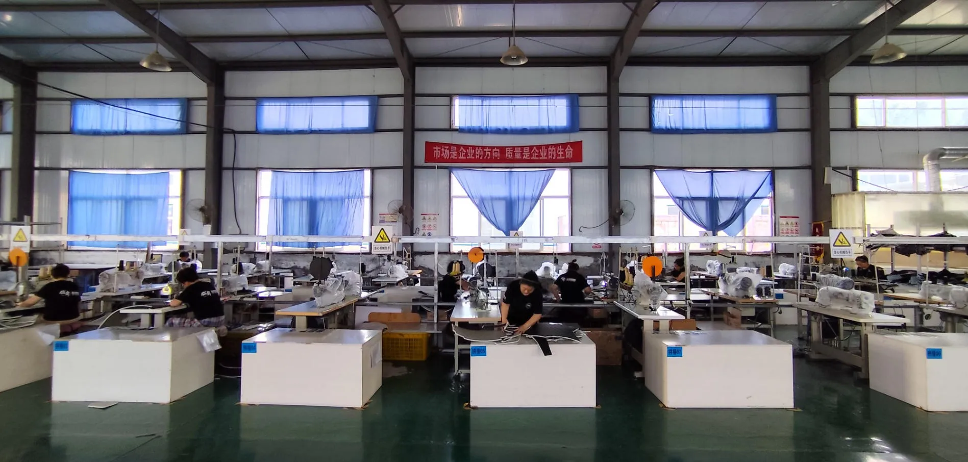 Gluebar EV floor mat production and quality inspection in industrial sewing workshop